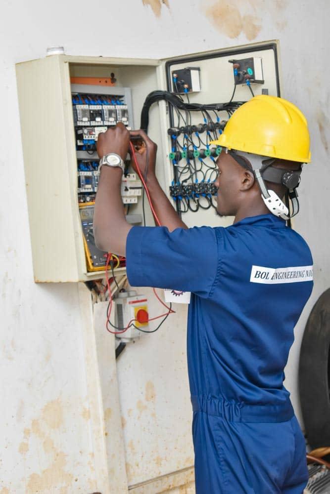 BOL Engineering technician working on an electrical control panel