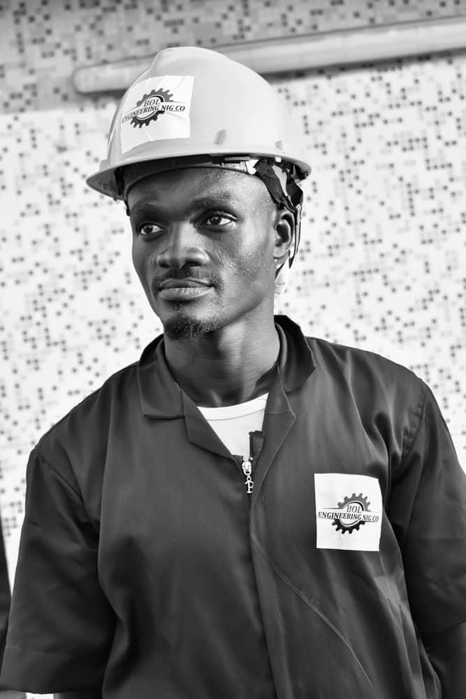 BOL Engineering technician in a white hard hat and branded uniform